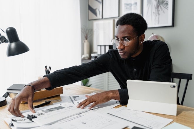 accountant working at desk with paperwork