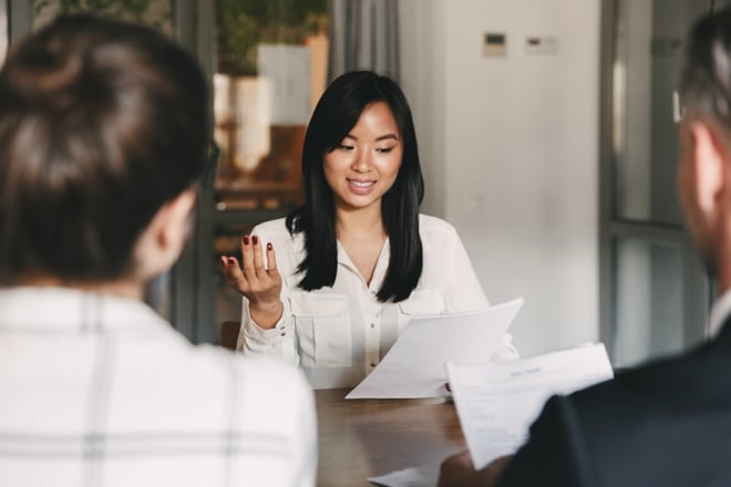 business people discussing insurance paperwork