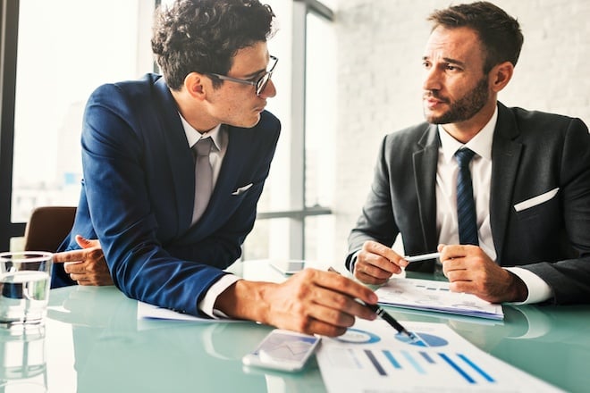 Business Colleagues Meeting with Paperwork