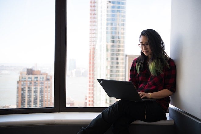 woman working on window ledge