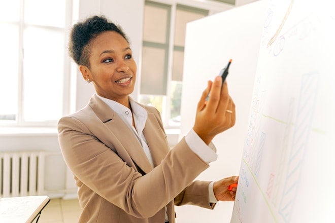 businesswoman holding pen